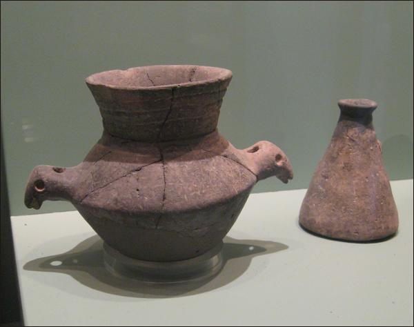 A small amphora with handles shaped like animal heads